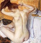 Woman Combing Her Hair by Edgar Degas